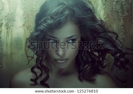 fantasy beauty portrait of a young dark skin woman in emerald tones