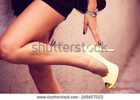 woman legs in high heel shoes outdoor shot