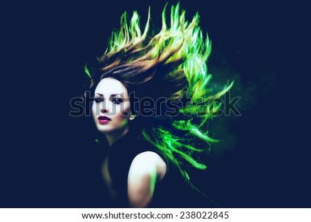 young woman dancing hair in motion green back light