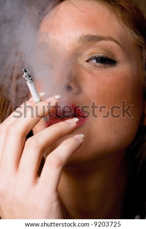 Young Women Smoking Slim Cigarette, Portrait In Studio Stock Photo ...