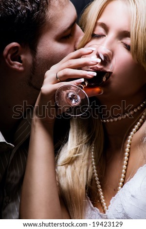 young couple in love celebrate with wine