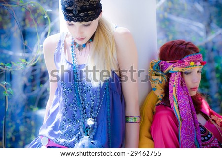 couple of women in oriental clothes in garden