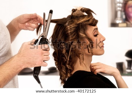 young woman at hairdresser, indoor shot