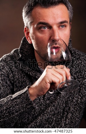 man with wine in the glass