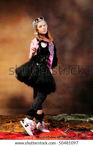 blond girl in a fancy clothes, studio shot