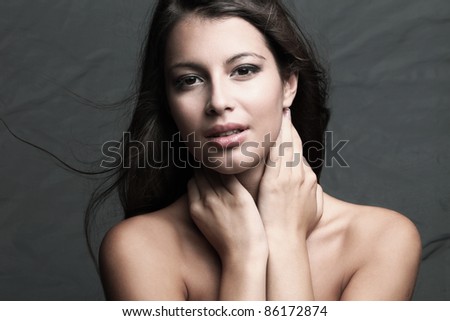 young brunette woman beauty portrait, natural look, studio shot