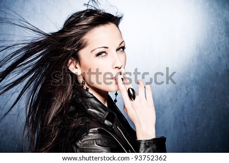 Black Hair Woman In Leather Jacket, Smoking, Studio Shot Stock Photo ...