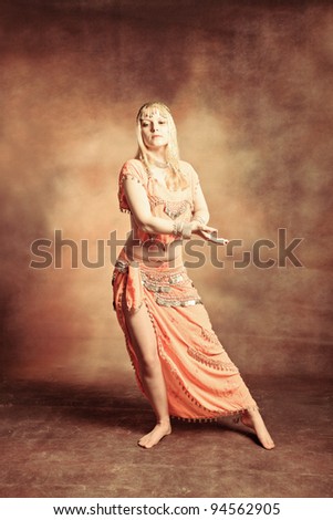 exotic belly dancer woman, small amount of grain added