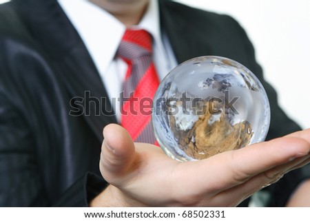 The worker of office shows that at it in hands planet globe