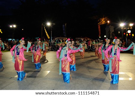 CHIANGMAI,THAILAND - AUGUST 26:Dance is offerings to Princess Dara Rasmi.300 people dedicated to the beautiful women dance at Three Kings Monument plaza. on August 26,2012 in Chiangmai,Thailand.