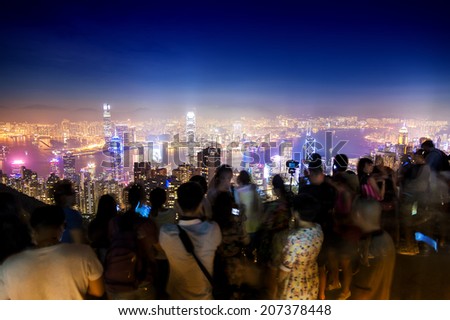 HONG KONG - July 7 : The Peak ,Tourists come to see the beauty of the buildings at dusk.The important point here is not to be missed on tour. on July 7,2014 in The Peak ,Hong Kong.