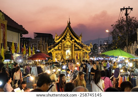 CHIANG MAI THAILAND - MARCH 8 : Sunday market walking street, The city center Thai temple marketing and trading of local tourists come to buy as souvenirs. on March 8 , 2015 in Chiang Mai, Thailand.