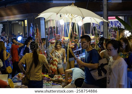 CHIANG MAI THAILAND - MARCH 8 : Sunday market walking street, Night marketing and trading of local tourists come to buy as souvenirs. on March 8 , 2015 in Chiang Mai, Thailand.