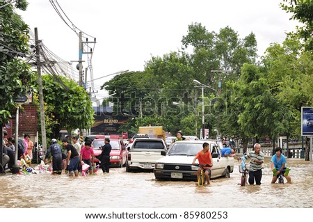 CHIANG MAI THAILAND - SEPTEMBER 28 : Flooding the Chiangmai city.Flood level of the traffic is going to be difficult on September 28,2011 in Chiangmai Thailand