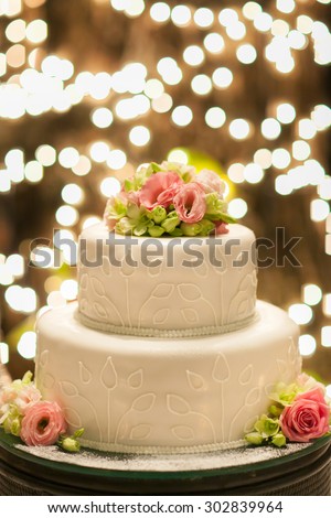 Wedding cake set up on table in wedding ceremony