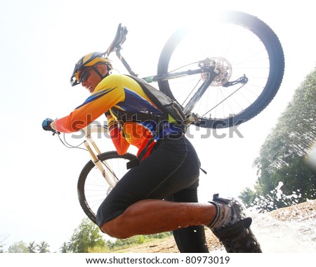 Person up hold bike in mountain bike game.