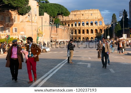 ROME, ITALY-APRIL 21, 2012: The Colosseum, or the Coliseum, one of the greatest works of Roman architecture and Roman engineering, at the end of the street, on April 21, 2012 in Rome.