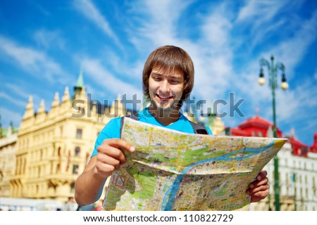 Young tourist couple with route maps looking for a way