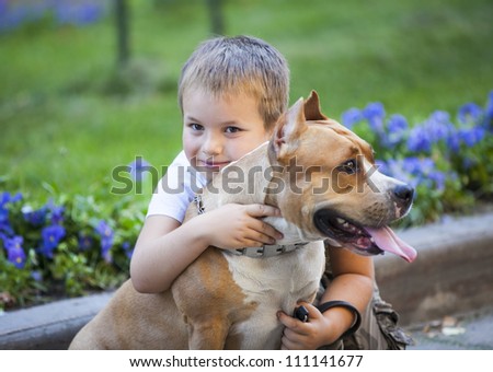 boy hug the dog. family and pet concept