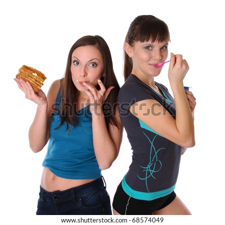 fat and thin girls eatting. isolated at white background