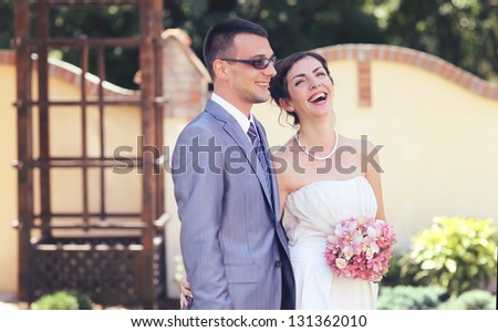 Laughter of a beautiful young bride on her wedding day