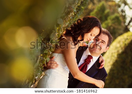 Bride and groom holding each other