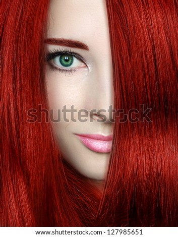 Beauty woman with red bright hair. Closeup portrait of style female model