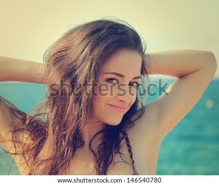 Vintage sexy woman portrait joy on sea background. Closeup