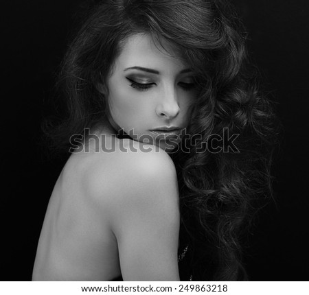 Beautiful makeup woman looking down. Black and white portrait
