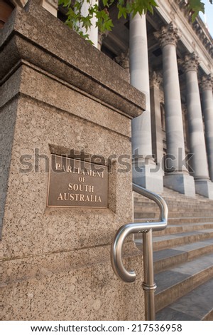Adelaide, Australia - May 8, 2013: Signage outside the entrance to the South Australian Parliament.  The stone steps and columns are a popular spot for wedding photographs on weekends