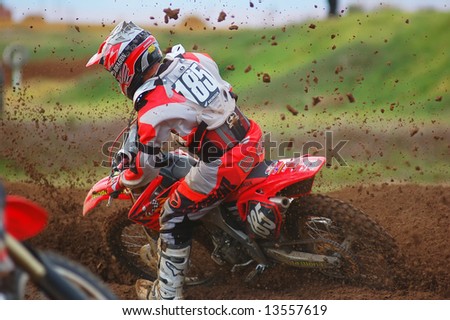 Motocross Rider powering out of a corner