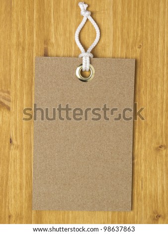 Carton square label on wood background
