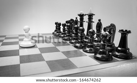 Single pawn against many enemies as a symbol of difficult unequal fight or struggle of minorities.