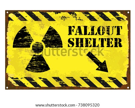 Grungy rusted enamel fallout shelter with radiation symbol sign
