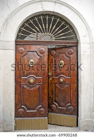 Old antique wooden door half-opened