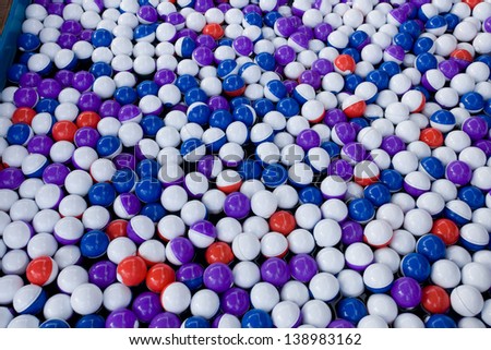 Coloured plastic balls in bouncy castle