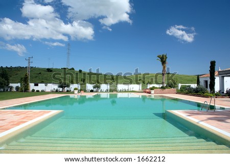 Beautiful, large swimming pool of rustic, country hotel in Europe