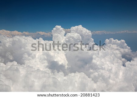 Large White Cumulus Clouds seen from Window of Airplane