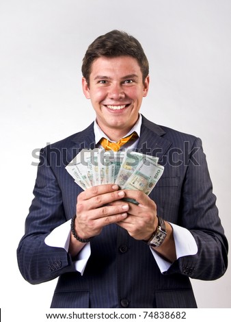 Businessman Holding Lots Of Money In His Hands Stock Photo 74838682 ...