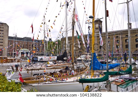 LONDON, UK-JUNE 1: Boats decorated with flags and bunting for the Queen's Diamond Jubilee celebrations, in St Katherine's dock near the Tower Bridge and the Tower of London. June 1, 2012 in London UK
