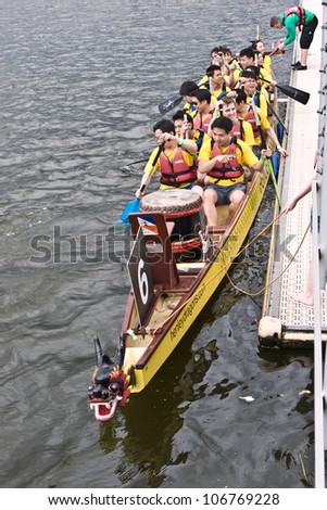LONDON, UK-JULY 1: View from above as  Dragon Boat team members  prepare for their race, in the 17th London Hong Kong Dragon Boat festival at the London Regatta Centre. July 1, 2012 in London UK
