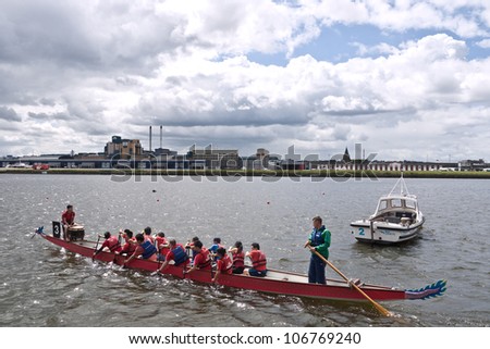 LONDON, UK-JULY 1:  Dragon Boat team members  prepare for their race, in the 17th London Hong Kong Dragon Boat festival at the London Regatta Centre in Docklands. July 1, 2012 in London UK