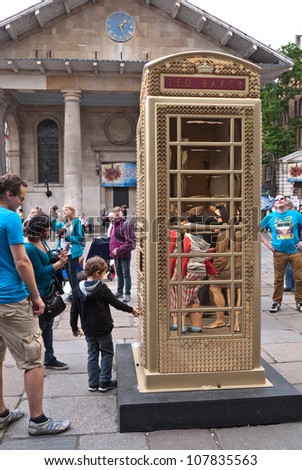 LONDON,UK-JULY 15:  Designer Ted Baker\'s Ding a Bling Box in Covent garden. BT Art Box an art installation and charity fundraiser using the iconic red phone box design. July 15, 2012 in London UK