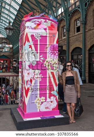 LONDON,UK-JULY 15:  Accessorize\'s  distinctly English design in Covent garden. BT Art Box an art installation and charity fundraiser using the iconic red phone box design. July 15, 2012 in London UK