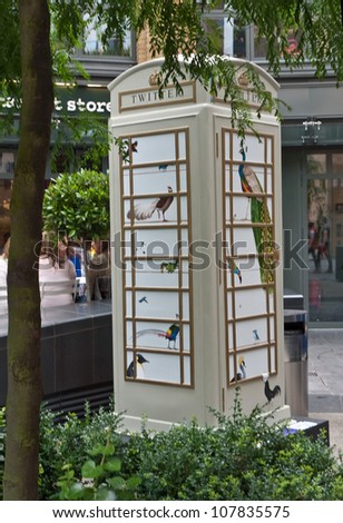 LONDON,UK-JULY 15:  Artist Rebecca Campbell\'s design Twitter for BT Art Box an art installation and charity fundraiser using the iconic red phone box design. July 15, 2012 in London UK