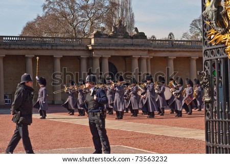 LONDON, UK - MARCH 19: Band of the Queen's Guard playing in front of Buckingham Palace during the Changing of the Guard Ceremony. March 19, 2011 in London UK.