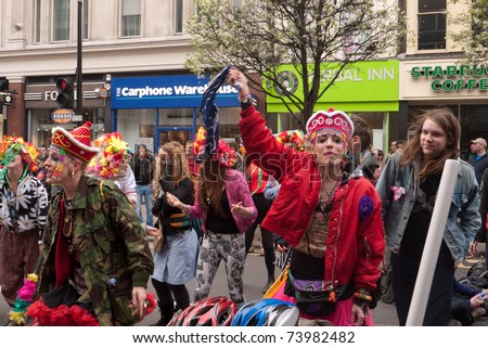 LONDON, UK-MARCH 26:A group of young people,  dance and occupy part of Oxford street during the day of protest against the cuts. March 26, 2011 in London, UK.