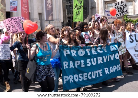 LONDON, UK- JUNE 11: Unidentified woman hold a banner at Slut Walk and rally on June 11, 2011 Trafalgar Square, London, UK. The woman are demanding the right to wear what they like without harassment
