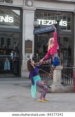 LONDON, UK-SEPTEMBER 5: Oxford Street\'s High Street Fashion Week launched with a circus themed fashion shoot at the iconic Oxford Circus,  ahead of London Fashion Week. September 5, 2011 in London UK
