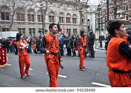 LONDON, UK-JANUARY 29: Unidentified Chinese Martial Arts team members take part in the parade, part of the famous London celebrations for the year of the dragon, January 29, 2012 in London UK